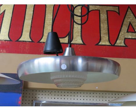An aluminium ceiling light with white underside and moulded glass ball shade 