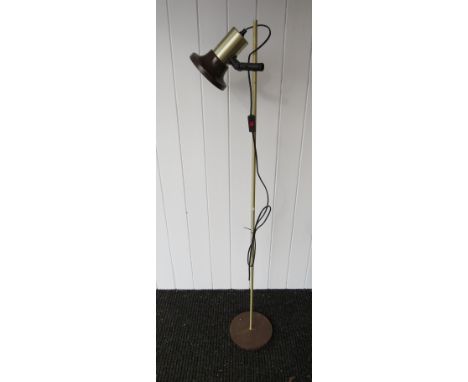 A brassed and brown standard lamp with single adjustable spot 