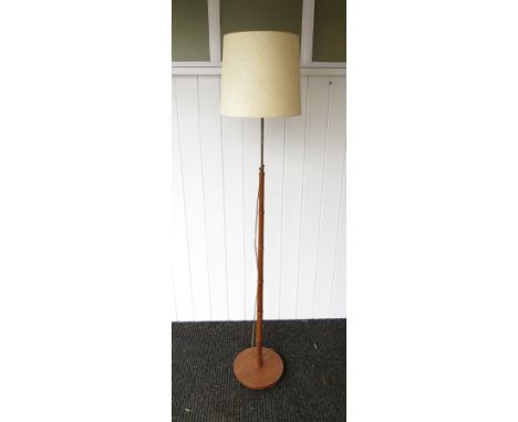 A Danish teak tapering standard lamp, ring decoration, original shade 