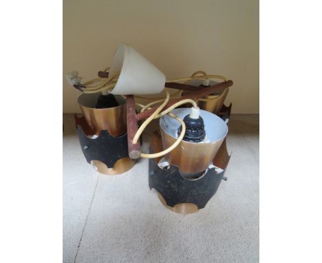 A Danish three pendant ceiling light, anodised copper shades, teak arm supports 