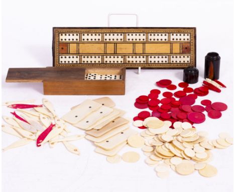 A SMALL PART SET OF BONE DOMINOES, a turned rosewood go-to-bed containing various gaming pegs, a cribbage board and a collect