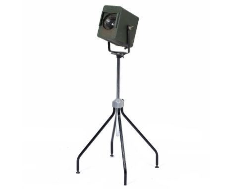 AN OLD GREEN PAINTED THEATRE LAMP 27.5cm long front to back on a later stand, the lamp and stand 128cm high (adjustable) At p