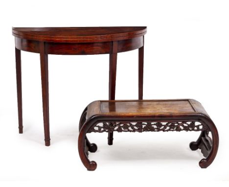 A CHINESE HARDWOOD LOW TABLE with scrolling ends and foliate carved undertier, 84cm wide x 41cm deep x 33cm high together wit