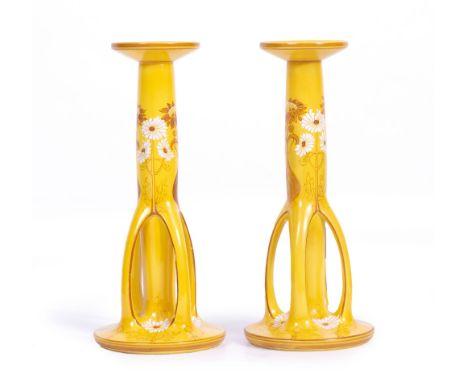 A PAIR OF 19TH CENTURY ART NOUVEAU ROYAL BON CANDLE STICKS of yellow ground, decorated with white flowers with printed and st