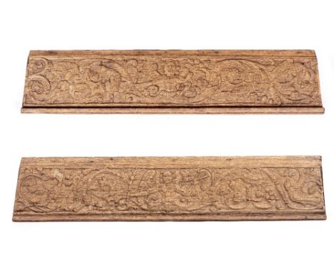 A PAIR OF ANTIQUE CARVED OAK ARCHITECTURAL FRAGMENTS depicting term figures flanked by scrolling foliage and birds, each appr