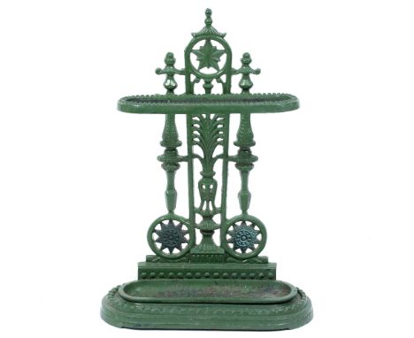 A GREEN PAINTED CAST IRON STICK STAND with decorative pierced back, rounded ends and inset drip pan 43cm wide x 62cm high  At