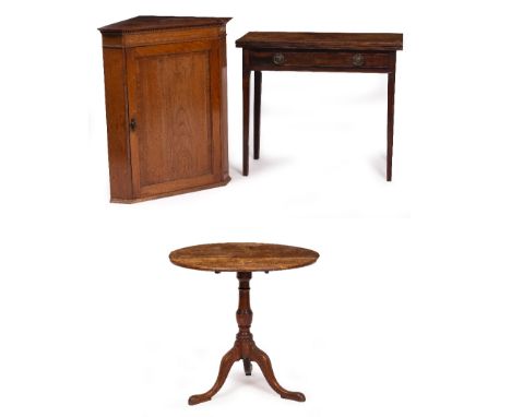 A 19TH CENTURY MAHOGANY FOLD OVER CARD TABLE with square tapering legs, 89cm wide; an oak tilt top tripod table, 76cm diamete
