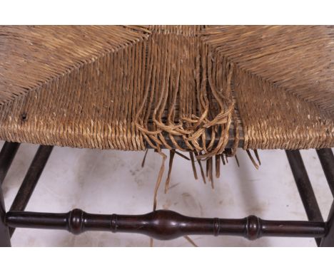 A SET OF SIX ANTIQUE ASH LADDER BACK CHAIRS with rush seats and turned supports (two carvers) At present, there is no conditi