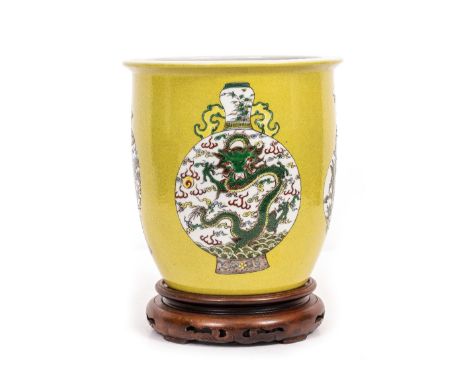 AN CHINESE PORCELAIN JARDINIEREthe yellow ground decorated with Chinese famille verte vases, Kangxi mark to base , 22.5cm dia