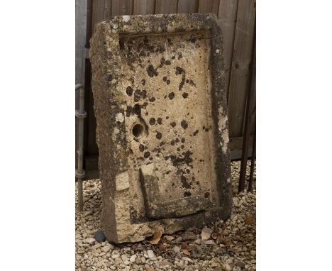 AN ANTIQUE CARVED STONE SHALLOW TROUGH 95cm wide x 91cm deep x 16cm high Condition: the trough with damaged corner in two pie
