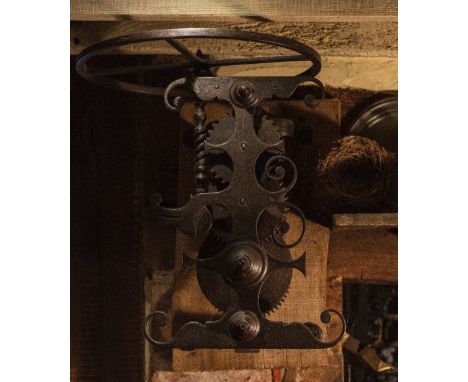 AN 18TH CENTURY POLISHED STEEL COUNTRY HOUSE SPIT ENGINE with decorative scrolls, 44cm high x 41cm wide x 50cm deep Condition