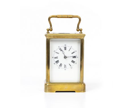 A BRASS CARRIAGE CLOCK OR TIMEPIECE with enamel dial, unsigned, 9.5cm wide x 8.2cm deep x 18cm high with handle up Condition: