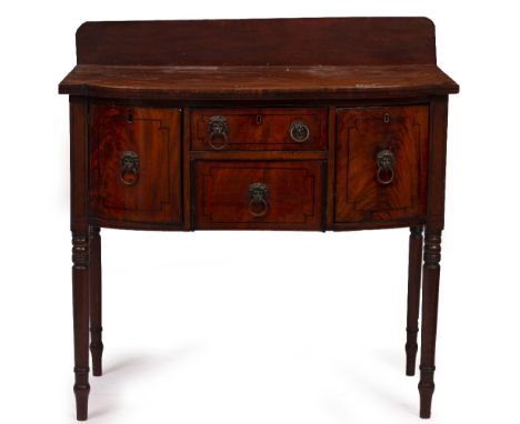 A GEORGE III MAHOGANY BOW FRONTED SIDEBOARD with later raised back, two drawers flanked by a deep drawer to one side and a cu