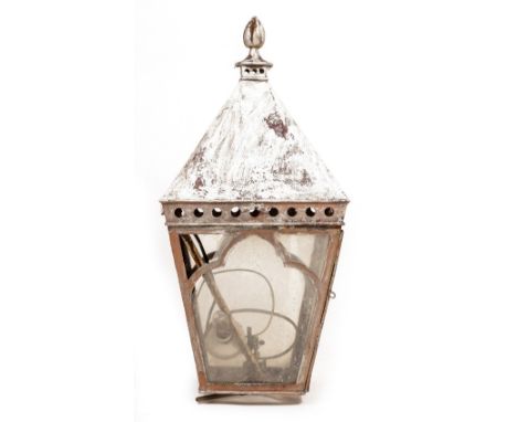 A CHAPEL LANTERN with Gothic style decoration and with wrought iron bracket, the lantern 38cm square x 80cm high, the bracket