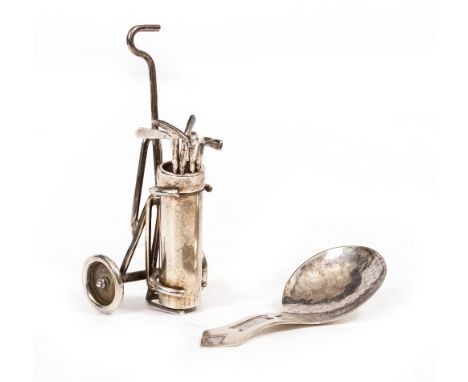 AN ELIZABETH II MINIATURE NOVELTY SILVER GOLF TROLLEY BAG AND FIVE CLUBS by Edward Victor Stanley with dates for London 1993,