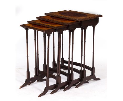A NEST OF FOUR GEORGIAN STYLE RECTANGULAR OCCASIONAL TABLES with burr wood oval inlay to the walnut veneered tops and with eb