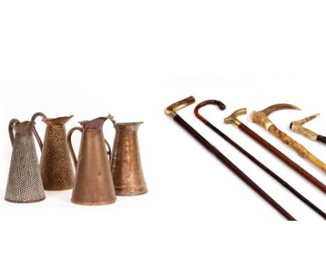 FIVE WALKING STICKS to include carved antler and brass handles, four brass jugs one stamped 3S&amp;S to base, an iron light f