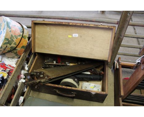 A wooden carpenters a box and a quantity of carpenters tools to include hand saws, planes etc.
