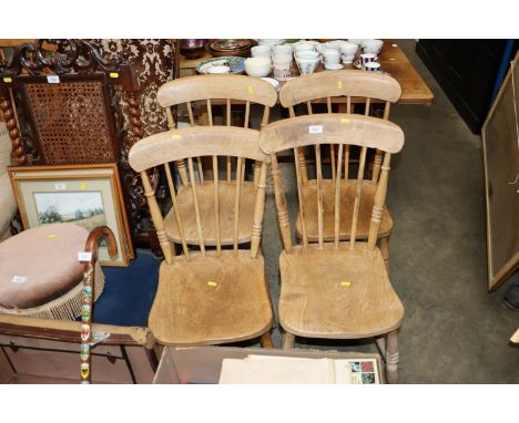 Four elm seated stick back chairs