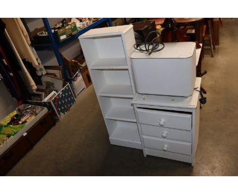 A white painted book shelf and white painted pine bedside chest fitted three drawers