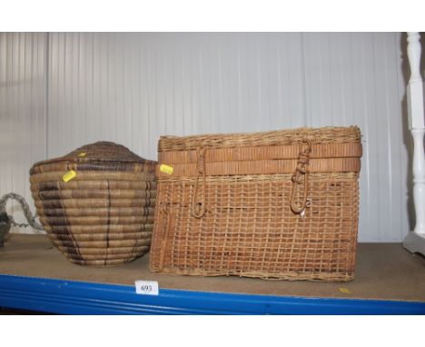 A wicker hamper, wicker wine bottle holder and a straw work pot with cover