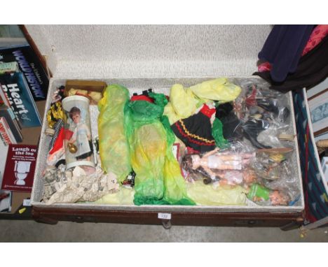 A vintage trunk and contents of foreign dolls, circa 1950s-60s etc.