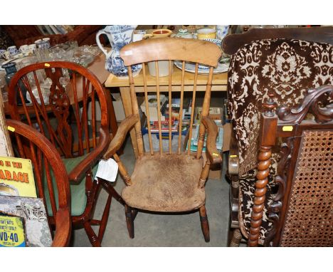 An elm seated and stick back elbow chair