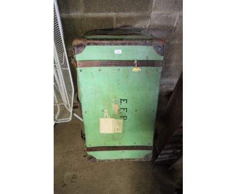 A green travel trunk