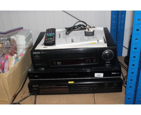 A Panasonic video player, A Blu-ray DVD recorder and a Rotel stereo tuner 