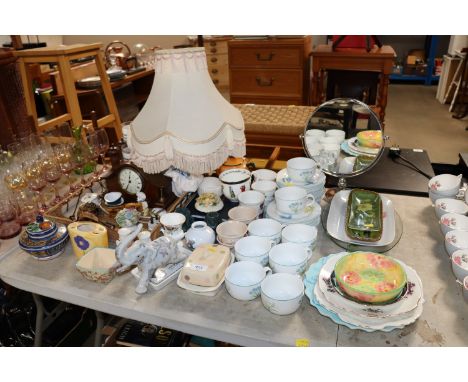 A collection of floral decorated teaware; various ornaments; decorative china; a table lamp; an Edwardian inlaid mantel clock