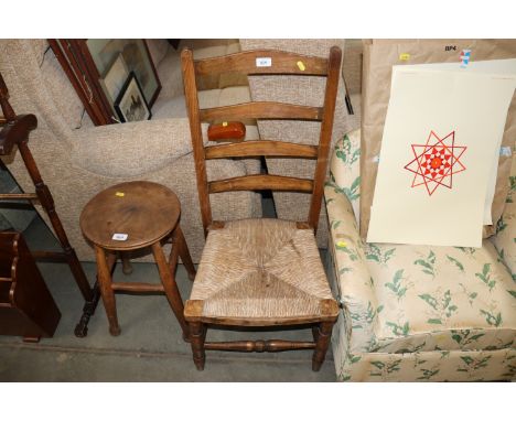 A rush seated and ladder back nursing chair