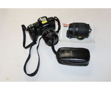 A Pentax camera and accessories
