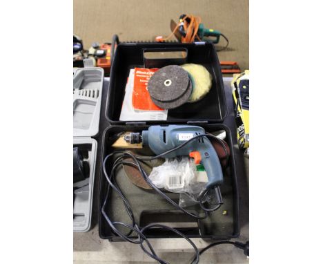 A Black & Decker KR500 electric drill in plastic case with user manual and various attachments  