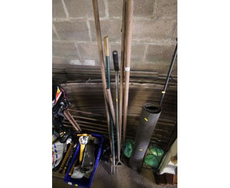 A quantity of long handled gardening tools, including forks, hoes, garden shears and a wheel brace etc 