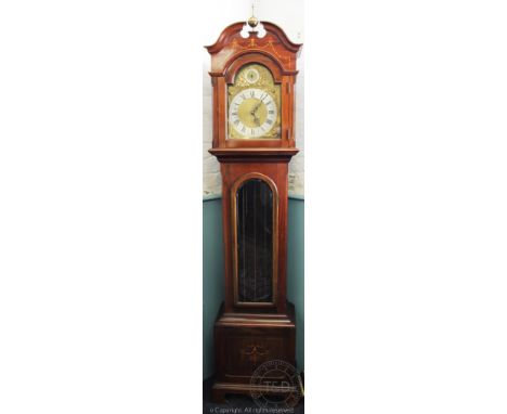 An Edwardian inlaid mahogany eight day longcase clock, with silvered Roman numeral chapter ring below a silent / chime select