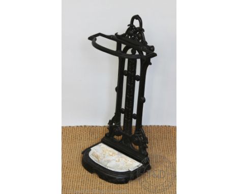 A Coalbrookdale style cast iron stick stand, with tray, 67cm high CONDITION REPORT: This is not a 19th century stick stand, l