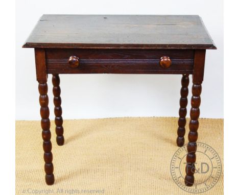 A late 17th century style oak side table with drawer, on bobbin turned legs, 75cm H x 86cm W x 54cm D, with an Edwardian inla