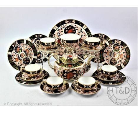 A Crown Derby Imari 198 pattern matched tea set, comprising six cups, six saucers and six side plates with blue printed marks