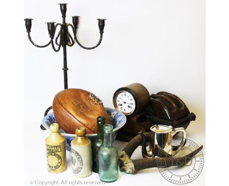 A miscellany of interior decorator items, to include a metal five light candelabra, a stoneware flask, a blue and white bowl,