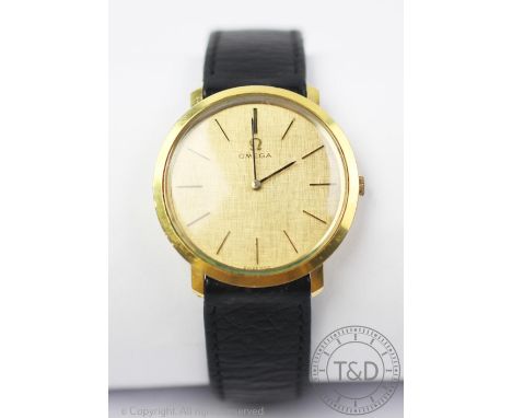 A vintage Omega gentleman's wristwatch, circa 1970, the yellow metal cased enclosing a circular face with baton dial, manual 