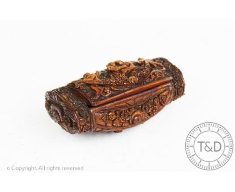 A 19th century French carved treen snuff box, decorated in high relief with a couple flanked by angels, the base carved with 