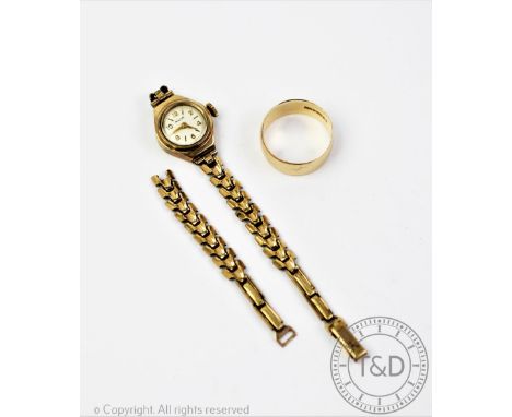 An Avia ladies wristwatch, the circular face with white enamel dial and gilt numerals and batons, within 9ct gold case and at