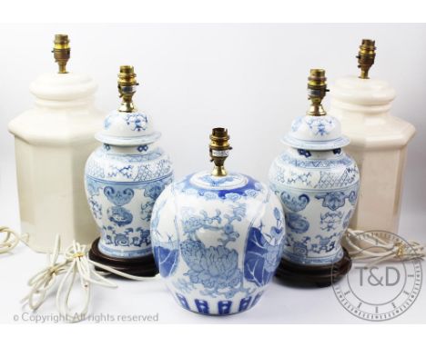 Five modern table lamps, including a blue and white pair and another blue and white example decorated with birds in the Chine