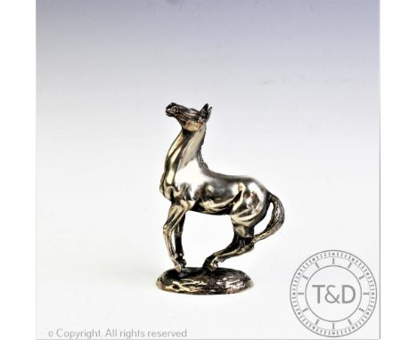 A British Horse Society silver sculpture of a horse 'Playing Up', by Lorne McKean, import mark for London 1975, 19.65 ozt, 11