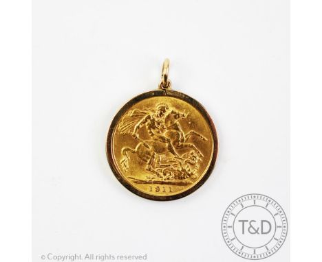 A George V gold sovereign dated 1911, within 9ct gold pendant surround, gross weight 9.33gms 
