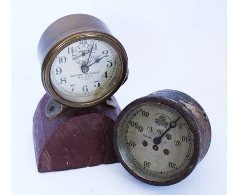 A blacked brass Smiths odometer, with 8.75cm dial, with an American automobile or aviation brass time piece, 'Sears-Cross' NY