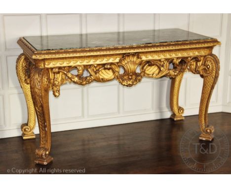 An impressive George II style carved gilt wood and gesso console table in the manner of William Kent, early 20th century, wit