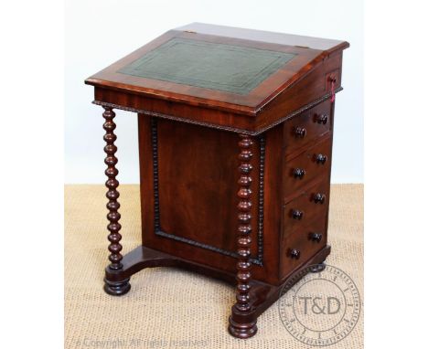A Victorian mahogany davenport, with leather inset slope enclosing an interior with four drawers, with four side drawers on b