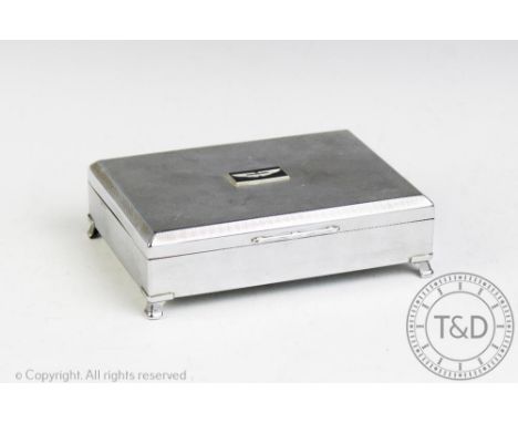 An Aston Martin chrome plated cigarette box by Aristocrat, with engine turned detailing, 17cm. These items may have been comm