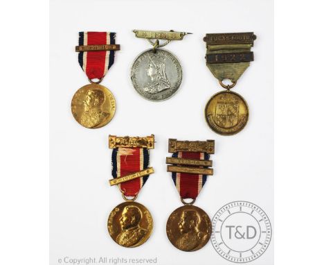 Three King George V 'The Kings Medal', to M. Harris, M. Greenaway and A. Rickenberg, with a Lucas-Tooth medallion and an 1894